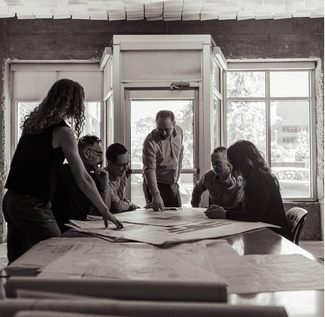 REGEN team reviewing plans at a table